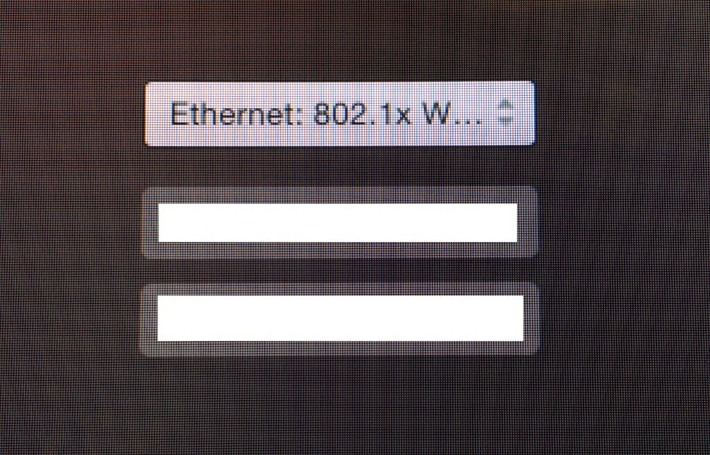 The OS X login window, demonstrating the 802.1x profile in use.